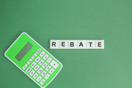 calculator and alphabet letters with the word rebate. business conceptの写真素材