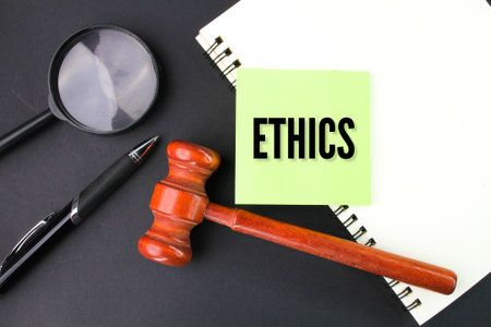 judge's gavel, pen, magnifying glass and paper with the word ethics. the concept of ethics or self-disciplineの写真素材