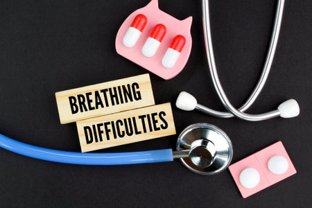 stethoscope and medicine with the word breathing difficulties. health and medical concepts