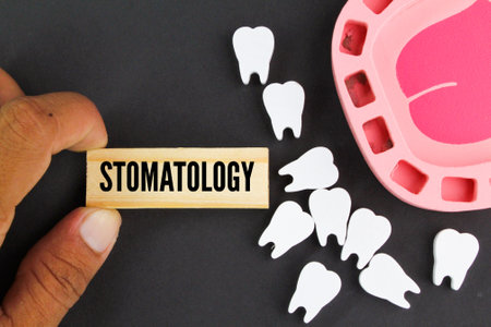 tooth shape with the word stomatology. dental care concept. medical and health conceptsの写真素材
