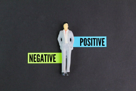 A man standing next to a stick figure with the words positive and negative on it. the concept of good or evil. toxic and good conceptsの写真素材