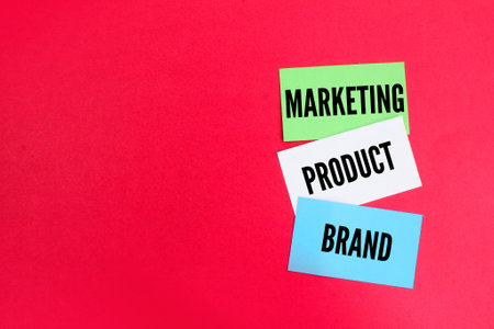 colored paper with the words product, brand and marketing. product marketing concept. business strategy concept. own brand conceptの写真素材