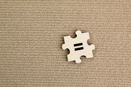 wooden puzzle with an equivalent icon. Symbol, equal, equal or same concept.の写真素材