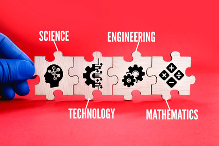 Wooden puzzle connection with STEM icon. science, technology, engineering, mathematics education word with icons.の写真素材