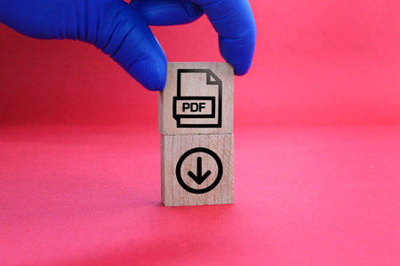 wooden square with PDF format file icon and download. the concept of saving a pdf file. concept pdf file formatの写真素材