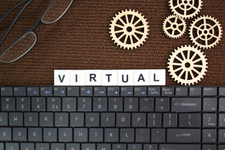 laptop keyboard, glasses with virtual words. the concept of cyberspace or virtual reality
