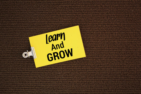 colored paper with the words Learn and Grow. business concept evolves. the concept of...