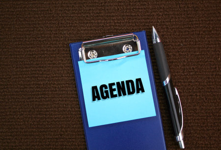 pen and paper board with the word Agenda. the concept of the main agenda or today's agendaの写真素材