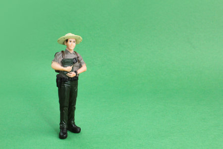 a miniature policewoman stands. the concept of police or guard women. police conceptの写真素材