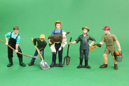a group of miniature laborers. the concept of farm labor or general workersの写真素材