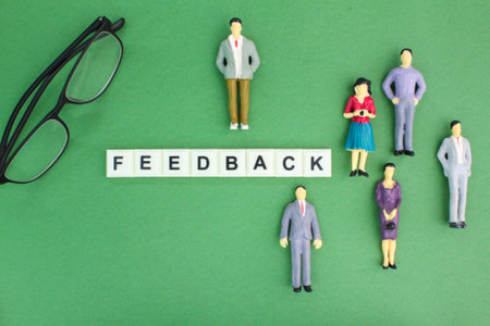 miniature people and glasses with the word feedback or response. customer review concept. Customer services.の写真素材