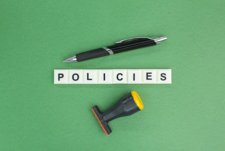 judge's gavel, stamp and pen with the word policies. the concept of policy or privacyの写真素材
