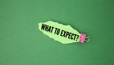 torn colored paper with the word question or question what to expect. the concept of hope