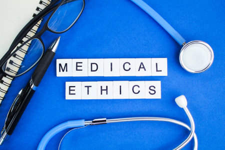 stethoscope, pen and glasses with the word Medical Ethics. concept of medical ethicsの写真素材