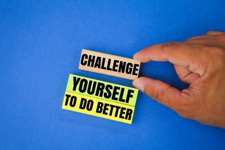 colored paper and sticks with words challenge yourself to do better. the concept of attitude guidanceの写真素材