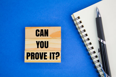 pen, book and stick with the words can you prove it. the concept of proving something