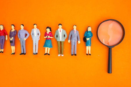 miniature people and magnifying glass. the concept of finding people or employees.  Business Person Candidate People Group. Employer of choice, candidate selection.の写真素材