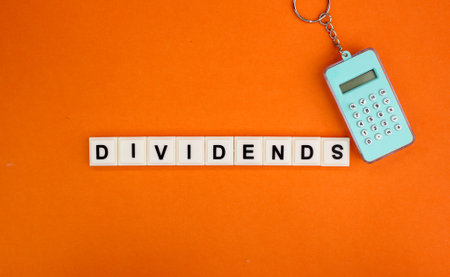 small calculator with the word dividends. the concept of income or earnings. the concept of profitの写真素材