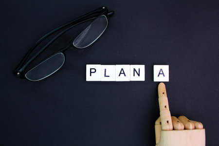glasses and letters of the alphabet with the word plan A. the main plan concept. Business and Plan conceptの写真素材