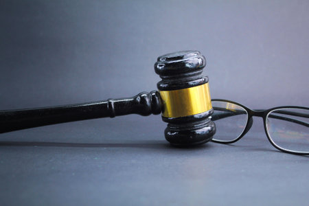 judge's hammer or gavel and glasses. the concept of justice or sentencingの写真素材