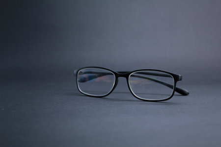 glasses with a dark background. premium glasses concept. learning concept