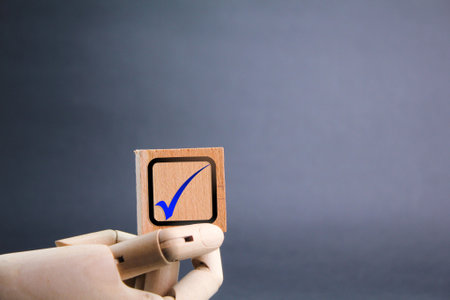 wooden cube with correct sign icon. Right sign concept. certified and correct mark. Standard certification, accurate selection, production standards and good quality. An ethical coの写真素材