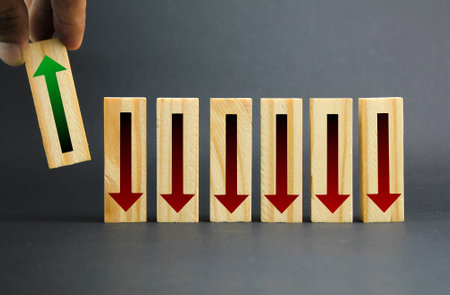 stick with red downward and green upward arrow icons. hand choose up arrow. the concept of inflation. the concept of taking profit or increasing incomeの写真素材