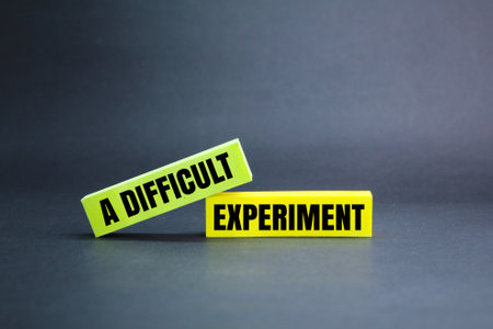 colored paper with the words a difficult experiment. the concept of trying hardの写真素材