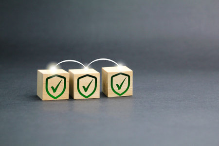 wooden cube with three signs of protection. the concept of safety and security. Technology internet...