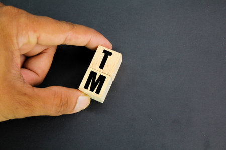 wooden cube with the letter TM. trademark concept.の写真素材