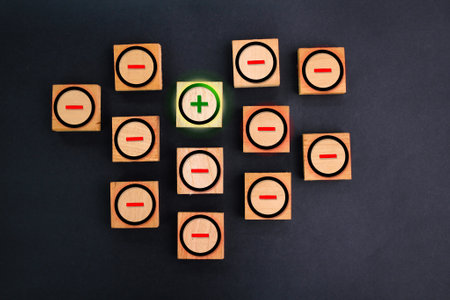 wooden cube with positive and negative symbols. protection concept. virus and antivirus concept. the concept of positive and negative thinkingの写真素材