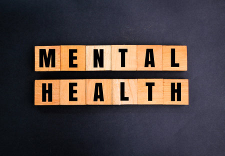 wooden square with the word mental health. mental health conceptの写真素材