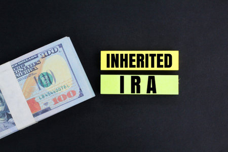 banknotes and paper colored with the word Inherited IRA. business conceptの写真素材