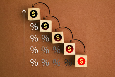 Wood cubes with money icons and percent. The concept of earnings or income increases. rate increase, performance increase, sales increase, business growth , percent growthの写真素材