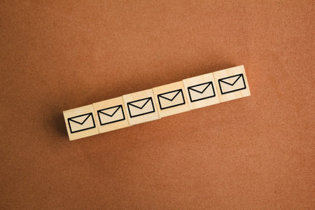 wooden cube with a row of email icons. the concept of email has not been opened or read. business concept via email. Business customer service and support online conceptの写真素材