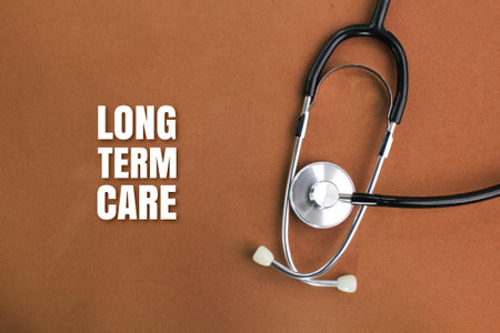 stethoscope with the words LONG TERM CARE. health or self care concept. HEALTH CARE concept. health insurance conceptの写真素材