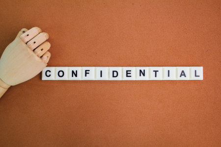 Judge's hammer and letters of the alphabet with the word confidential. the concept of confidential information. or something difficultの写真素材
