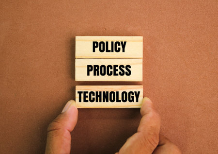 wooden puzzle of the word policy process technology. The Three Laws of Biometricsの写真素材