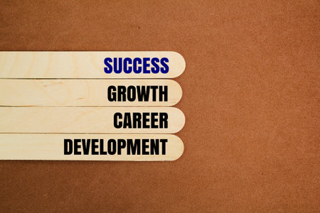 ice cream stick with the words Success, growth, career, development. the concept of a ladder to success. the concept of successの写真素材