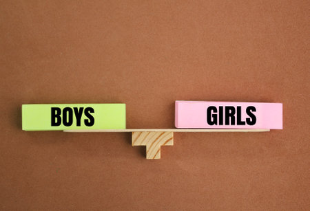 the balance of the words Boys and girls. the concept of equity. the concept of equality between men and womenの写真素材