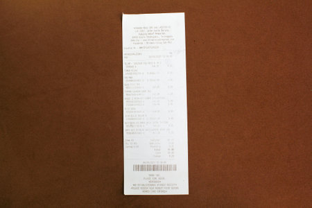 Malaysia, Kuala Terengganu : 22 August 2023-Paper sales receipt isolated on a dark background. proof of purchase conceptのeditorial素材