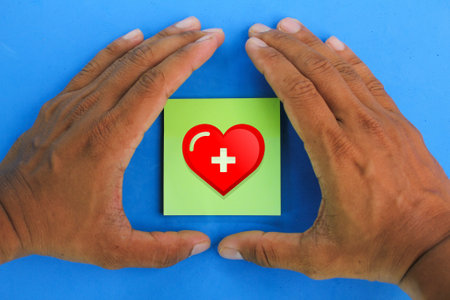 hand making protection on heart icon. health care coverage concept. medicare conceptの写真素材