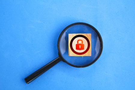 magnifying glass and lock icon. the concept of finding passwords is lost. the concept of being hacked or losing a passwordの写真素材