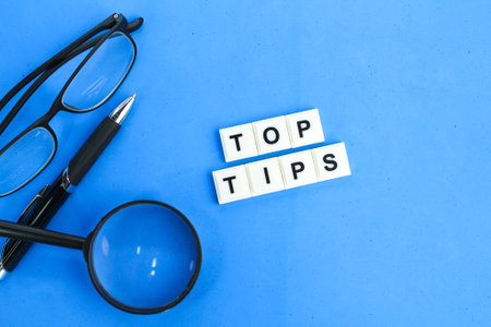 letters of the alphabet with the word top tips. the concept of finding or getting tips