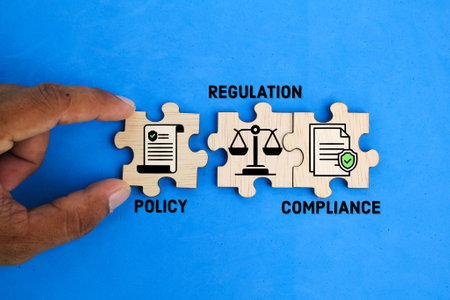 wooden puzzle and words are also icons of policy, rules and compliance. industrial concept. the basic concept of a company or industryの写真素材