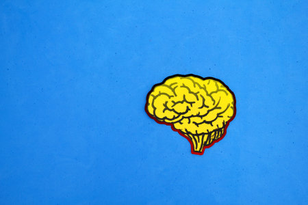 yellow paper brain shape. mental health. Neurology and Psychology care.の写真素材