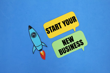 rockets and conversation bubbles with the words start your new business. new business concept