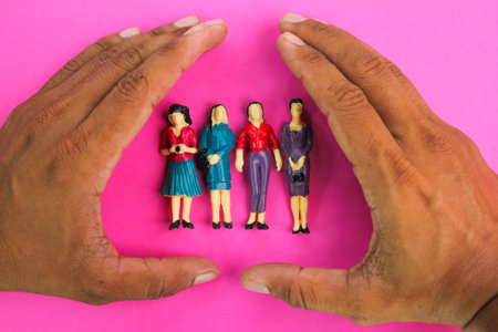 hands making close up of a group of women. the concept of women's protection. the concept of oppressionの写真素材