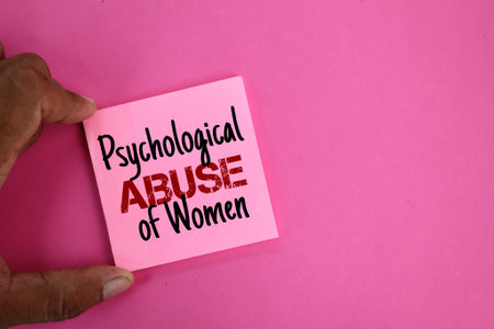 hand holding colored paper with the word psychological abuse of women. the concept of women's abuseの写真素材