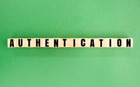 wooden cube with the word authentication. the concept of verifying verification. the process or action of proving or showing something to be true. valid concept. the concept of ideの写真素材